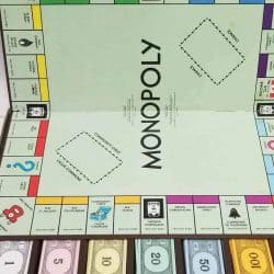Canadian Monopoly Board Game with play money below.