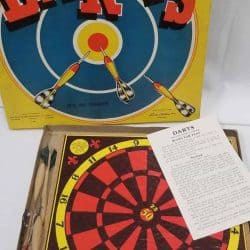 Box cover, instructions, and dart board with darts.