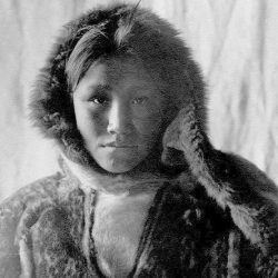 Black and white photo of a woman wearing fur