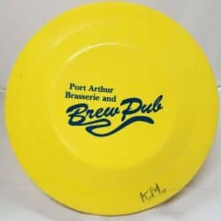 Yellow Frisbee with the logo for the Port Arthur Brasserie and Brew Pub.