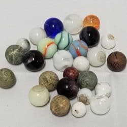 Variety of small glass marbles in all different colours.