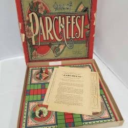 Board game Parcheesi with the instruction manual on top.