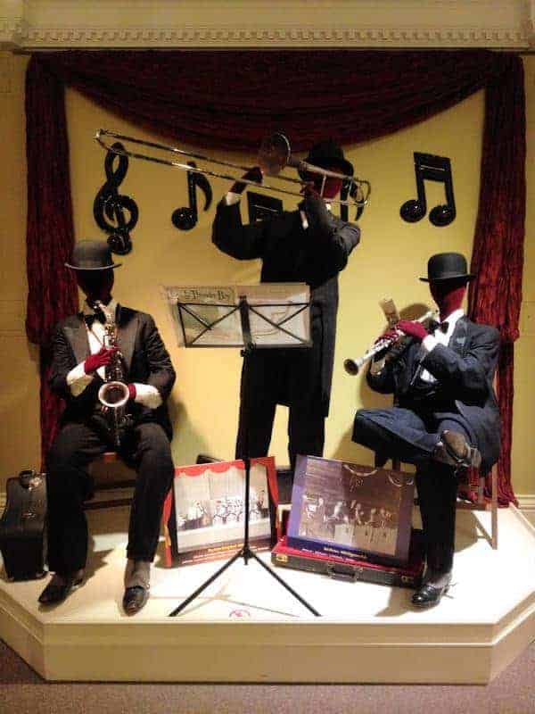 Gallery Exhibit of mannequins playing a saxophone, trombone, and clarinet