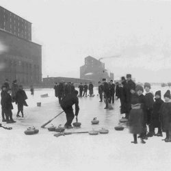 Old photograph of people curling on a river