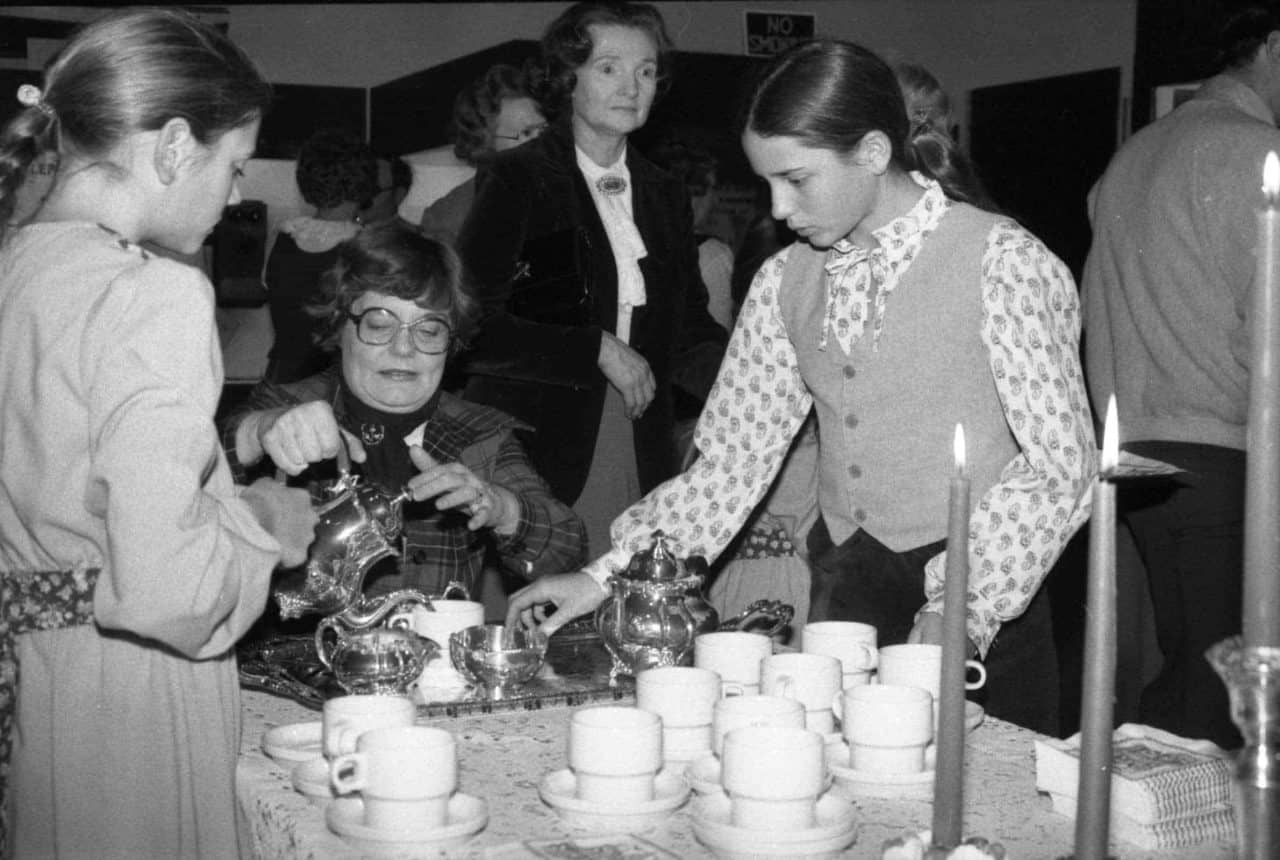 old photo women serving tea