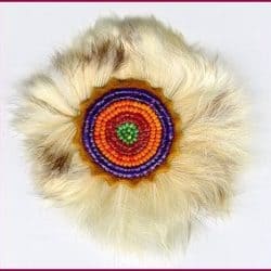 Seed beads on leather surrounded by rabbit fur