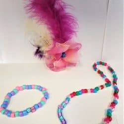 Flower with feathers handcrafted fascinator with a beaded bracelet and matching necklace.