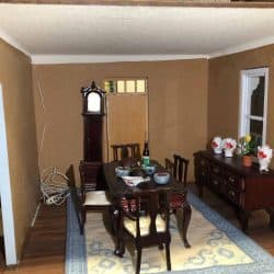 Dollhouse dining room with a large grandfather clock