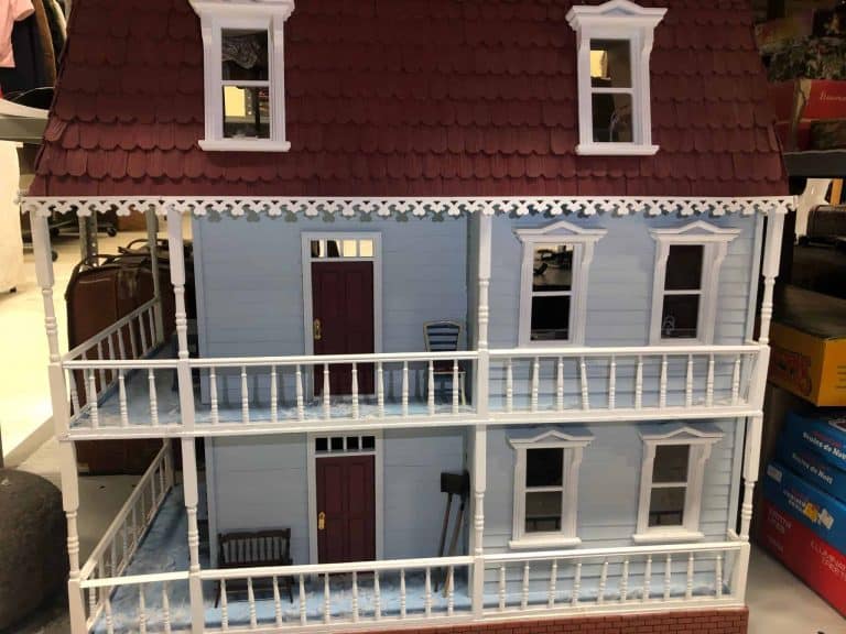 Two and a half story dollhouse with wrap around porches on both floors