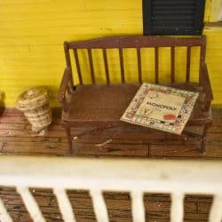 Bench on the porch at the front of the house.