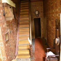 Hallway with a staircase going to the second floor.