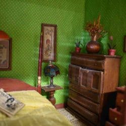 Dresser in a green bedroom.