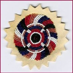 Seed beads in circular pattern on leather patch.