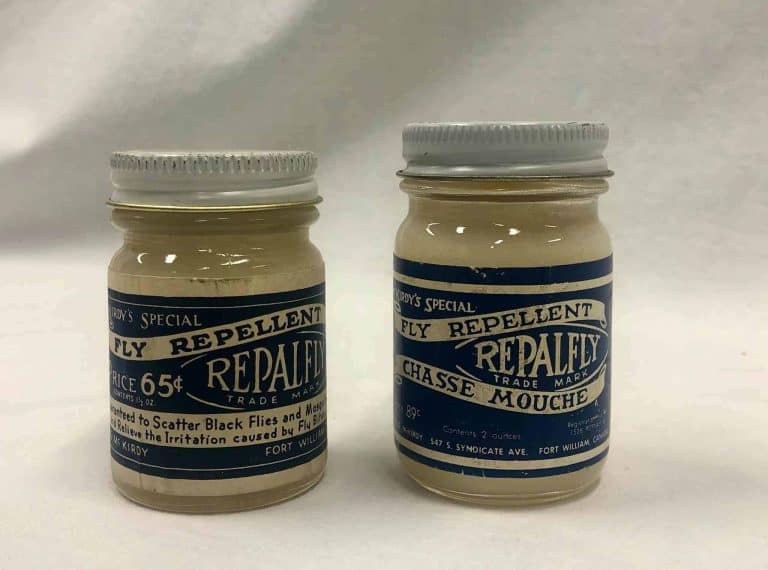 Two small jars labeled as fly repellent