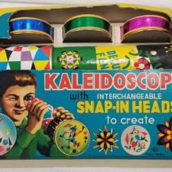 Cardboard box of a kaleidoscope with interchangeable snap-in heads to create.