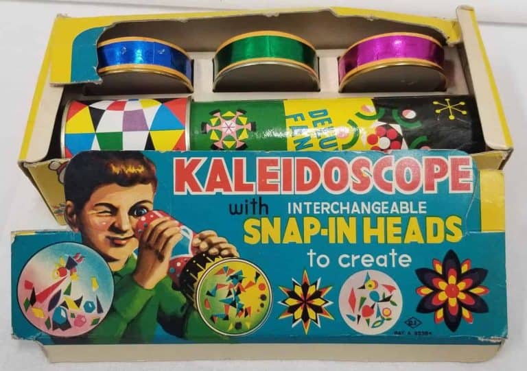 Cardboard box of a kaleidoscope with interchangeable snap-in heads to create.