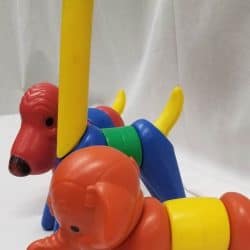 Sideview of plastic puzzle animals including an elephant, giraffe, and dog.