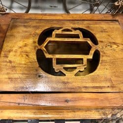 Wooden carved out area that opens up to store a radio inside
