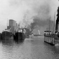 Black and White Photograph of large ships in the habour