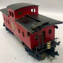 Red wooden train with a black roof