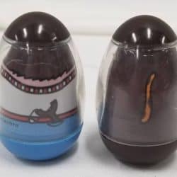 Back of two weebles. On the left a boy and the right a dog.